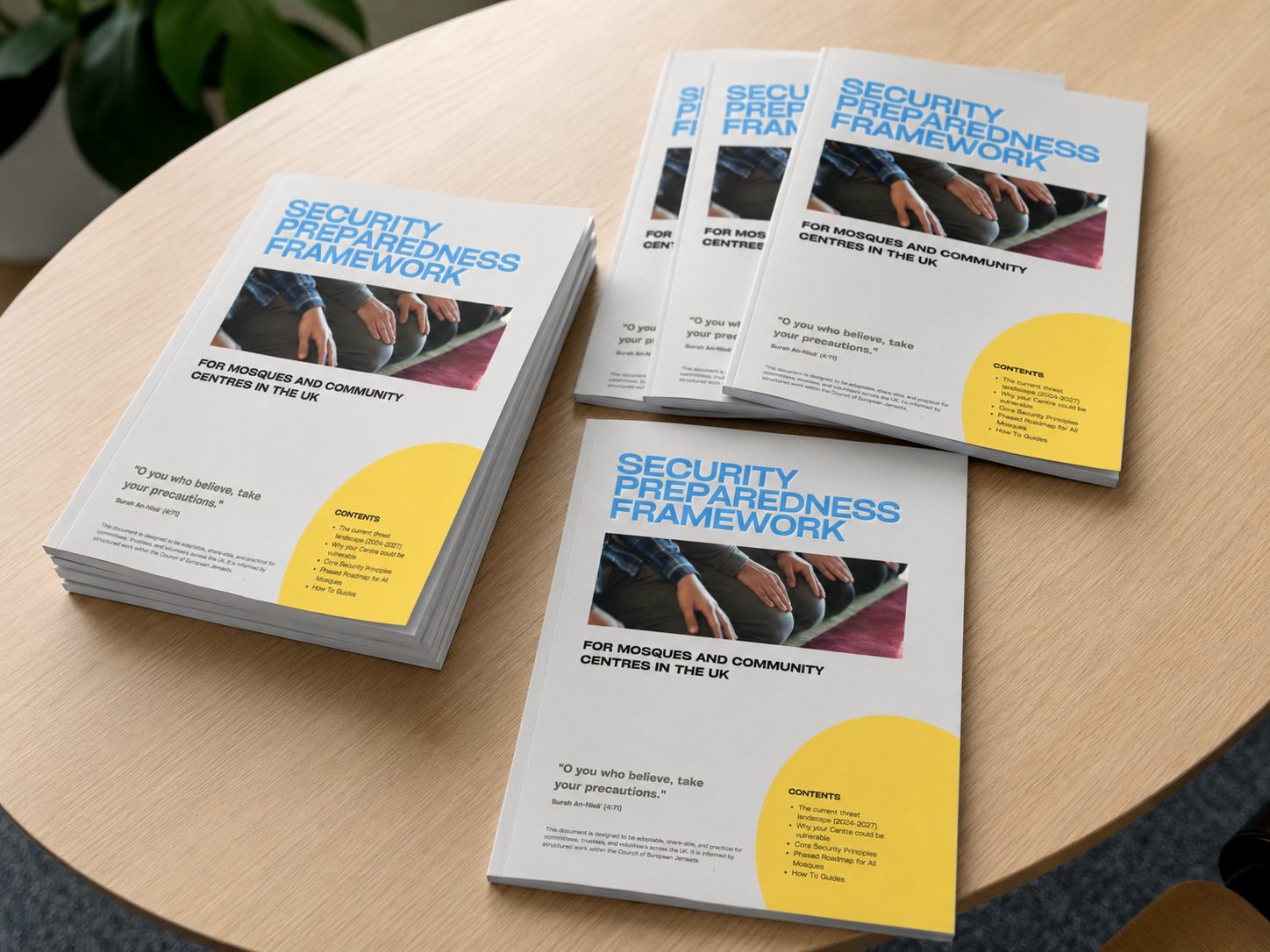 Printed copies of the Security Preparedness Framework booklet for mosques and community centres, on a table